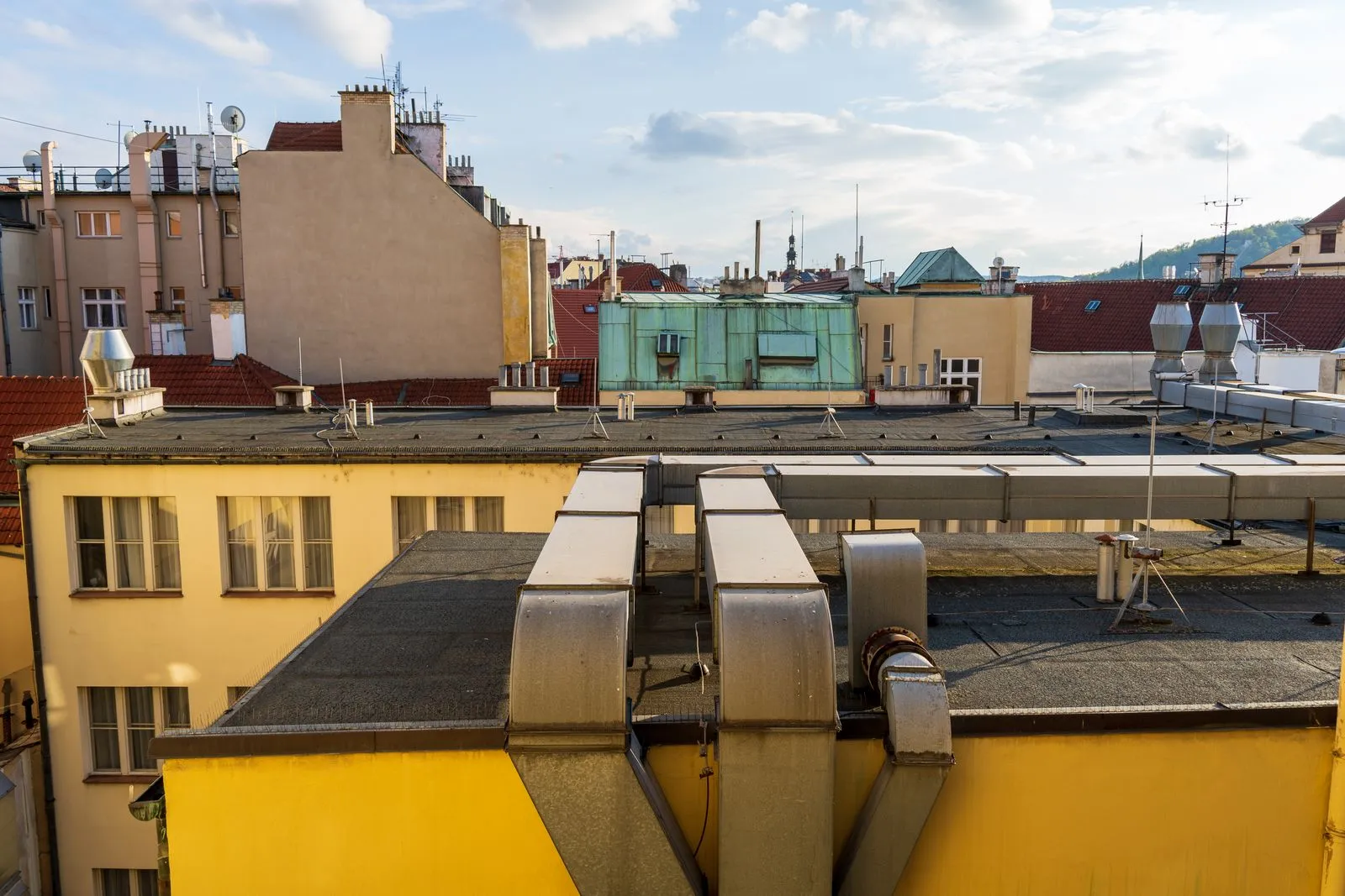 Detailed view of an urban rooftop landscape in a historic city during the day.